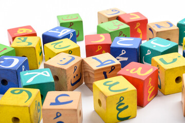 Wooden Arabic Alphabet Blocks isolated on white background. Arabic Alphabet Cubes. Preschool and education concept. Copy space