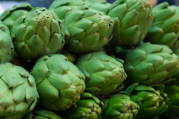 Fototapeta premium artichokes are on the counter at the market