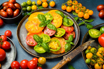 A plate with vegetarian tomato salad. Keto diet, healthy food. Fresh salad bowl. Top view.