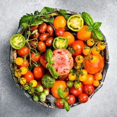 Organic food. Fresh tomatoes in a wooden box. Top view.