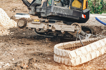 Excavator with brocken track awaiting for repair 
