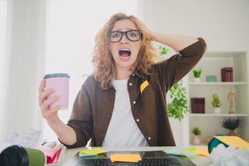 Photo of mad furious stressed depressed busy woman drink espresso sit table work hard home indoors...