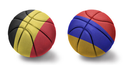 basketball balls with the national flags of armenia and belgium on the white background.