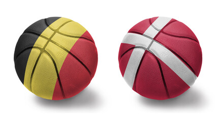 Obraz premium basketball balls with the national flags of denmark and belgium on the white background.