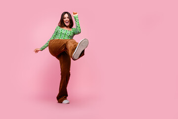 Photo of lovely cute cheerful woman wear stylish clothes dance discotheque empty space isolated on pink color background