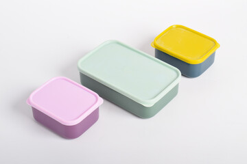 Three colorful Lunch Boxes isolated on white background. Plastic food containers
