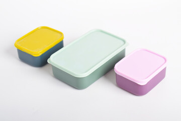 Three colorful Lunch Boxes isolated on white background. Plastic food containers