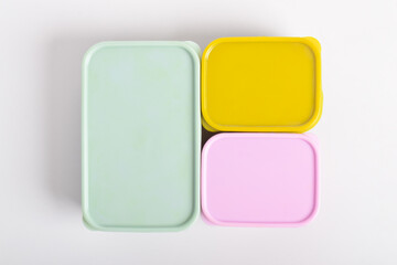 Three colorful Lunch Boxes isolated on white background. Plastic food containers