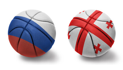 Fototapeta premium basketball balls with the national flags of georgia and russia on the white background.