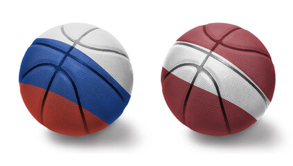 basketball balls with the national flags of latvia and russia on the white background.