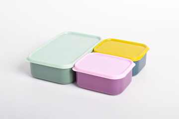 Three colorful Lunch Boxes isolated on white background. Plastic food containers