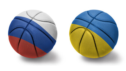 Obraz premium basketball balls with the national flags of ukraine and russia on the white background.