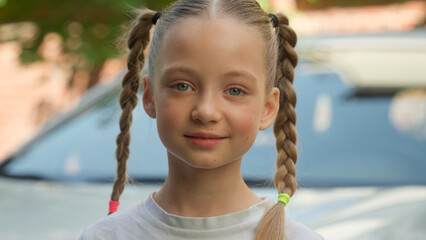 Happy glad smiling Caucasian little child kid school girl pupil looking at camera smile schoolgirl...