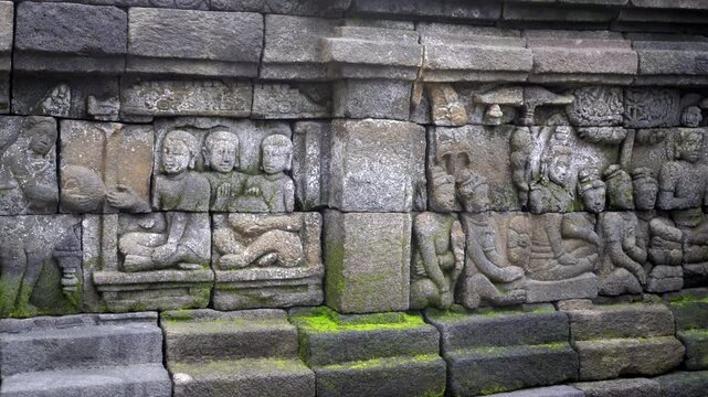 Indonesia,Jawa Island,Yogyakarta, Unesco world heritage Borobudur Temple's inside, wall reliefs, telling stories from history and buddhist religion.