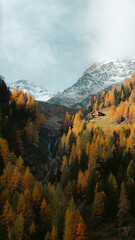 Stunning mountain scenery in fall with old farmhouse at sunrise, Osttirol region, Tyrol, Austria