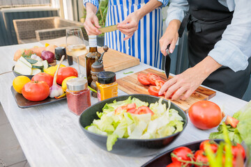 Woman Preparing Fresh Ingredients Outdoors for Entertaining Guests