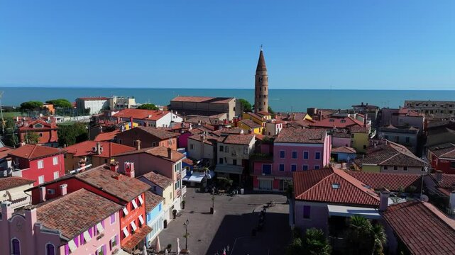 stunningly beautiful colors of the Caorle Italy old-town and historic landmarks Duomo di Santo Stefano Protomartire and Madonna dell'Angelo church
