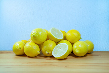 lemons and limes on wooden table