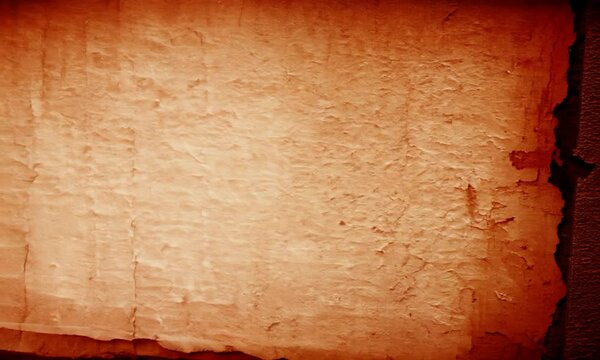 Vintage Textured Paper Background: A weathered, aged parchment texture with a faded, sepia-toned hue. This distressed paper background exudes a sense of history, authenticity, and nostalgia.