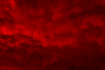 Red night sky background. Blurred photo of dark red sky. Photo can be used for the concept of Halloween and galaxy space background.