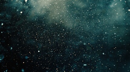 Obraz premium A mesmerizing view of floating particles in a dark, cosmic atmosphere.