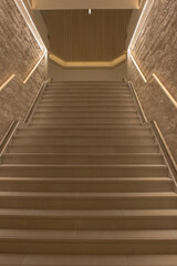 interior of white staircase with lighting in building