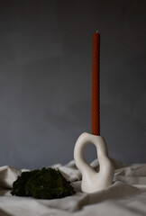 Handmade beeswax candle, interior design with authentic decor