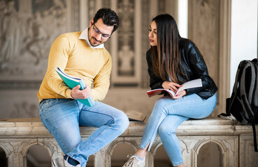 Two students studying indoor in a university open space