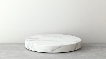 Marble round display pedestal on a concrete background, ideal for product photography.