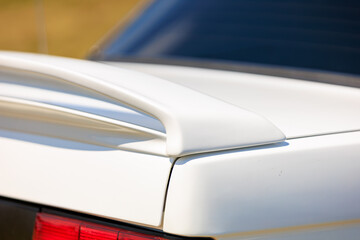 Close-Up of White Car Spoiler on Vehicle Trunk