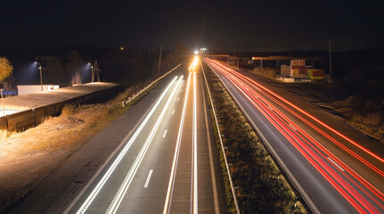 Highway car light trails at night.