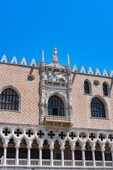 Doge's Palace is ornate Gothic palace buildings hosting exhibitions with duke's rooms, prison and armoury tours. Venice Italy.