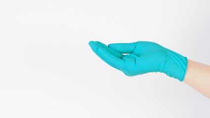 Empty ands wear aqua mint green latex gloves on white background.