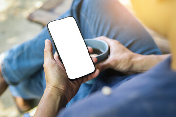 cell phone blank white screen mockup.hand holding texting using mobile on desk at office.background empty space for advertise.work people contact marketing business,technology
