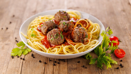 bowl of spaghetti with meatballs and tomato sauce