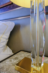 Luxurious ocean view or oceanview or outside balcony veranda cabin stateroom suite queen king double bed on luxury ocean liner cruiseship cruise ship in classic classy interior Art Deco style design