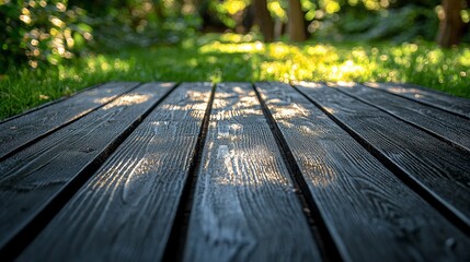 Fototapeta premium A close-up view of wooden planks on a grassy path, surrounded by greenery and sunlight.