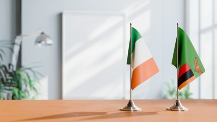 FLAGS OF IRELAND AND ZAMBIA ON TABLE