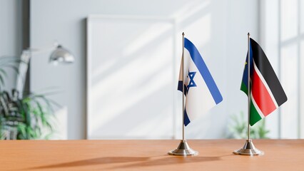 FLAGS OF ISRAEL AND SOUTH SUDAN ON TABLE