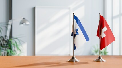 FLAGS OF ISRAEL AND SWITZERLAND ON TABLE