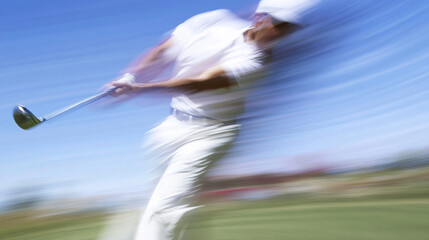 Golfer Executing a Powerful High-Speed Swing with Blurred Motion Effect