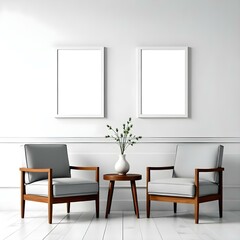 Two gray armchairs with wooden frames, a small wooden table between them, and two blank white frames on the wall above.