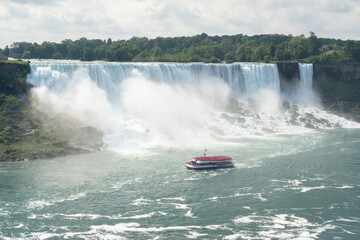 Fototapeta premium Touristic boat by the American Niagara Falls. High quality photo