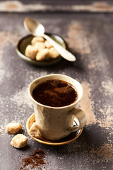 Mug of coffee on rustic wooden background. Copy space.