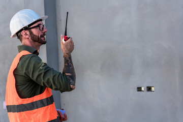 Caucasian construction foreman working at construction site