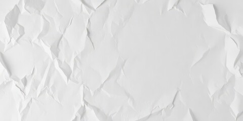 Obraz premium Crumpled white paper with visible creases and wrinkles on a flat surface, close-up, textured