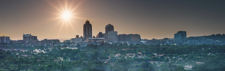 skyline, panoramic view of Sandton Central at sunset, south africa © poco_bw