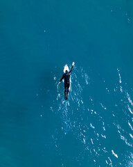 Top-Down Aerial of Surfer on Surfboard at Llandudno Beach