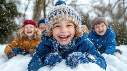 A joyful group of children playing in the snow, laughing and enjoying a winter day.