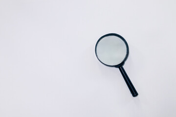 A magnifying glass on a white background